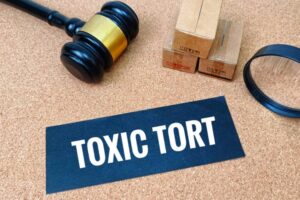 Toxic Tort Law Concept with Judge Gavel, Magnifying Glass and Boxes Representing Legal Investigation
